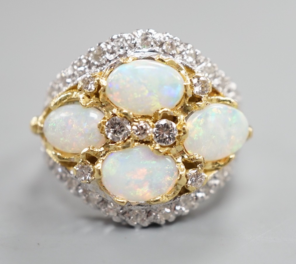 A modern 18ct white gold, diamond and four stone oval white opal set cluster dress ring, size N, gross weight 6.9 grams.